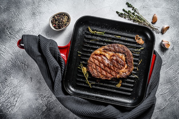 Grilled rib eye, ribeye  steak in a pan