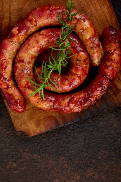 Photo grilled  or roasted spiral pork sausages