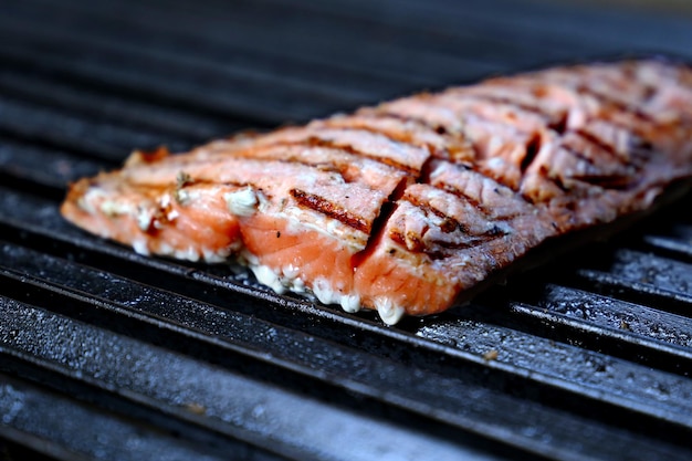 Grilled salmon on a barbecue in Brazil With coarse salt and grill marks