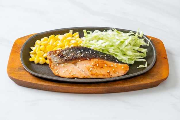 grilled salmon fillet steak on hot plate in Japanese style