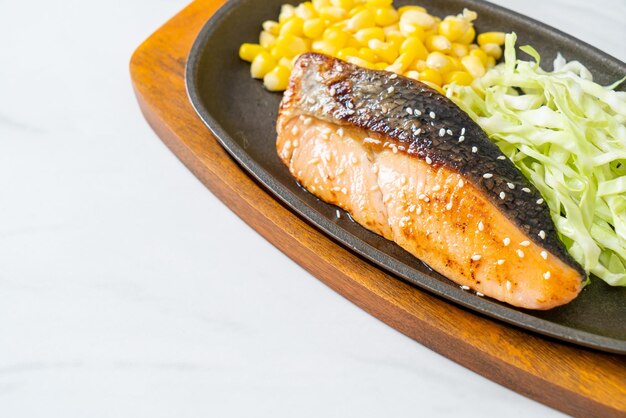 grilled salmon fillet steak on hot plate in Japanese style