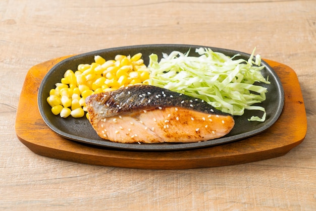 grilled salmon fillet steak on hot plate in Japanese style