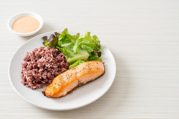 grilled salmon fillet steak with rice berry and vegetable - healthy food style