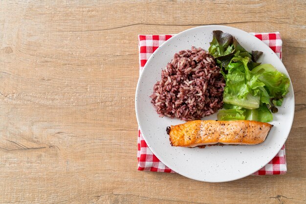 Grilled salmon fillet steak with rice berry and vegetable -\
healthy food style