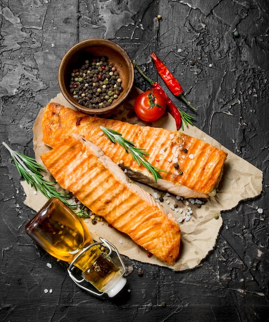 Grilled salmon fillet with rosemary branches