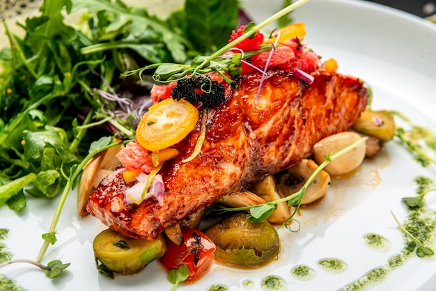 Grilled salmon fillet with vegetables mix Serving food in a restaurant Healthy food concept Photo for the menu