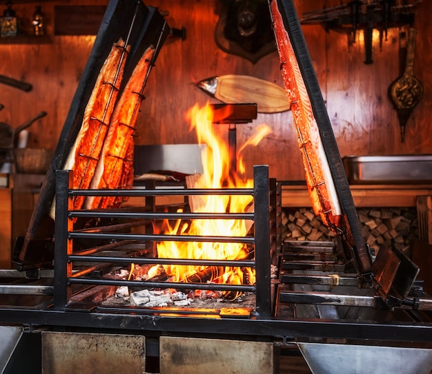 Grilled salmon fish on open fire