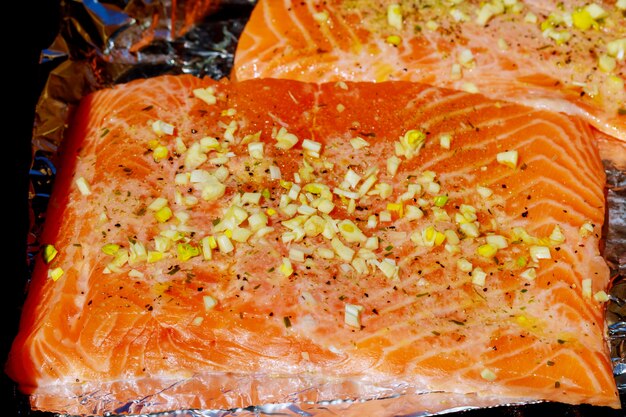 Grilled salmon on the flaming grill.