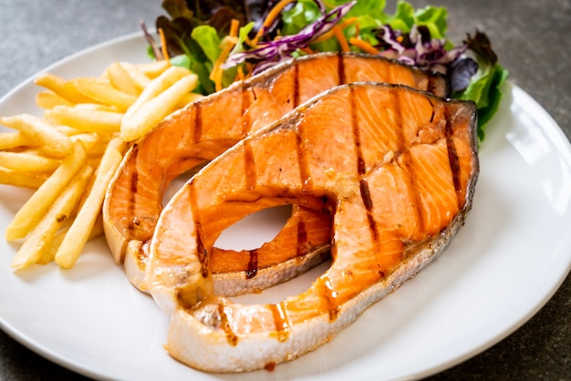 grilled salmon steak fillet with french fries