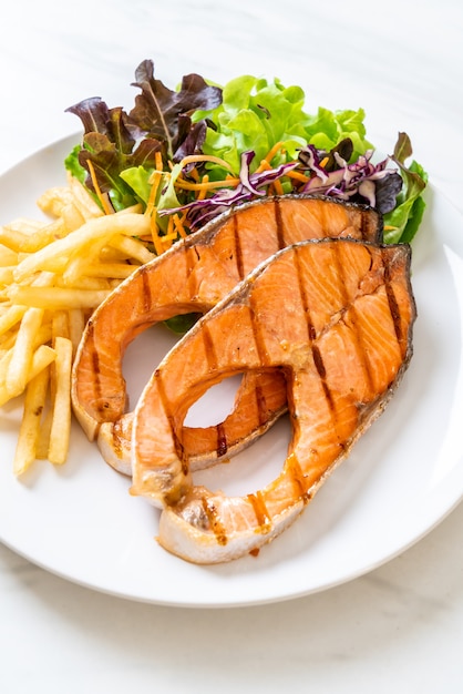 grilled salmon steak fillet with french fries