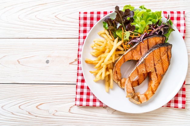 grilled salmon steak fillet with french fries