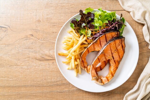 grilled salmon steak fillet with french fries