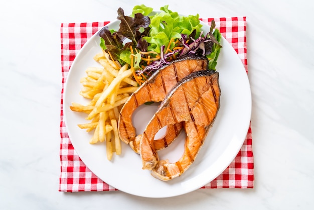 grilled salmon steak fillet with french fries