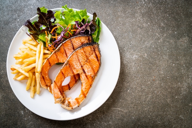 grilled salmon steak fillet with french fries