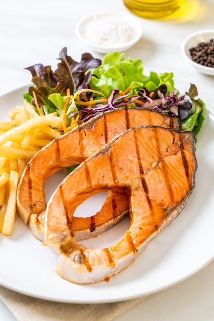 grilled salmon steak fillet with french fries