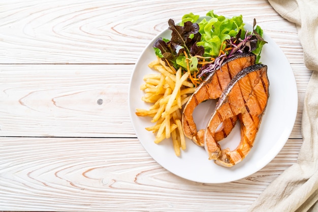 grilled salmon steak fillet with french fries