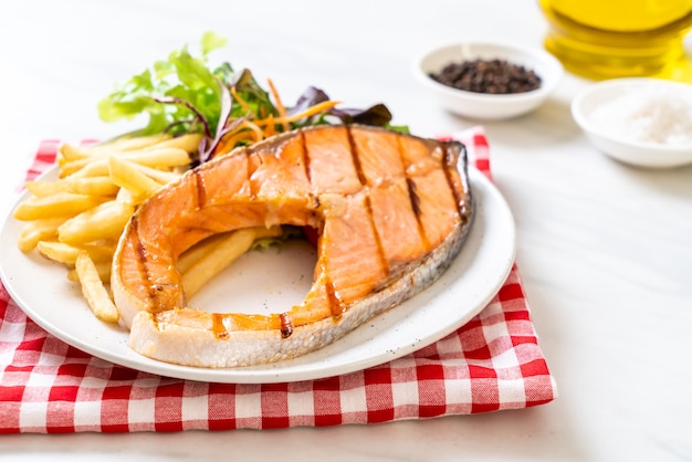 grilled salmon steak fillet with vegetable and french fries