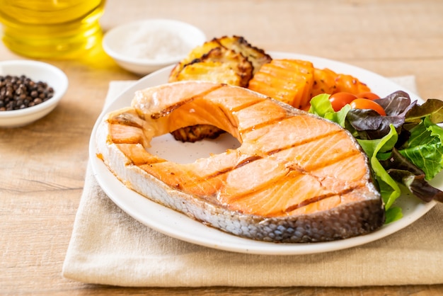 grilled salmon steak fillet with vegetable and french fries