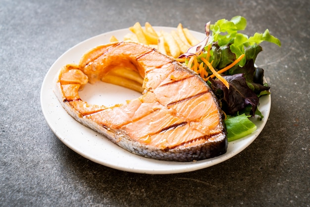 grilled salmon steak fillet with vegetable and french fries