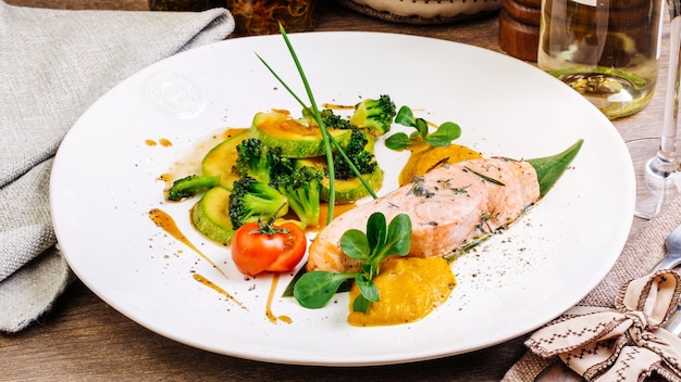 Grilled salmon steak on a round white plate