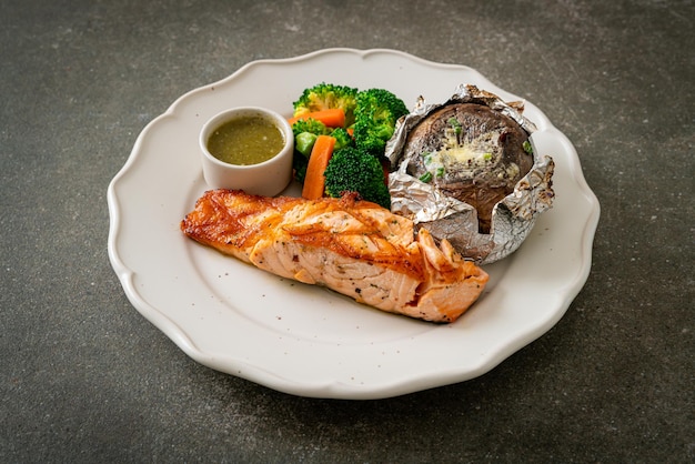 Grilled salmon steak with bake potato