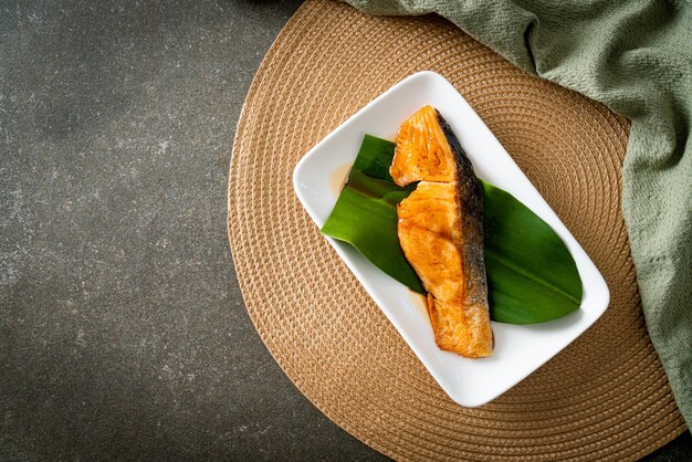 Grilled Salmon Steak with Soy Sauce on plate - Japanese food style