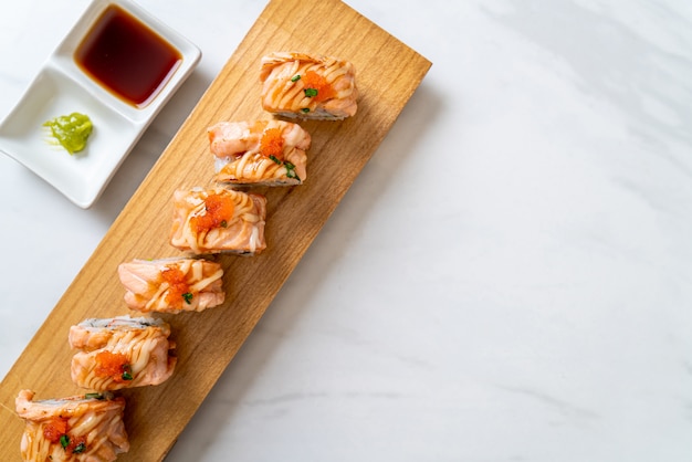 grilled salmon sushi roll with sauce