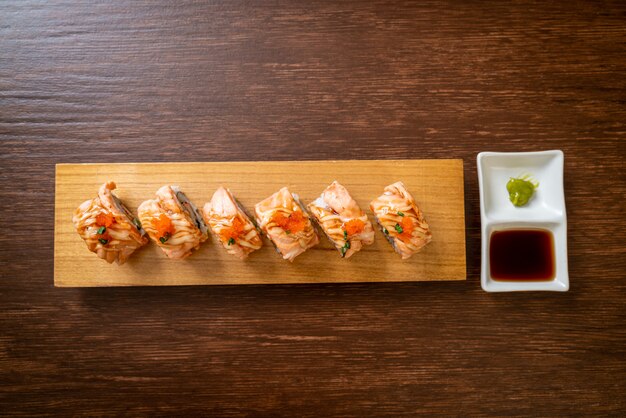 grilled salmon sushi roll with sauce