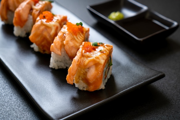 grilled salmon sushi roll with sauce