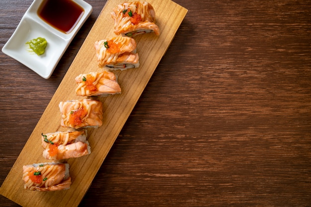 grilled salmon sushi roll with sauce