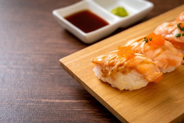 grilled salmon sushi on wood plate - Japanese food style