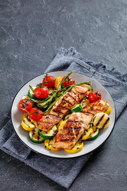 Grilled salmon and vegetables on a plate