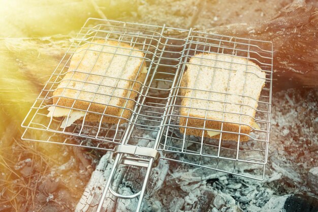 Grilled sandwiches cooked on charcoal Bread with cheese on the grill Toned