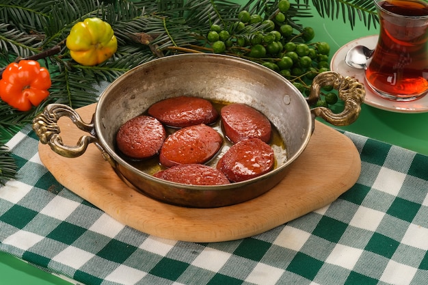 grilled sausage in a pan sucuk izgara