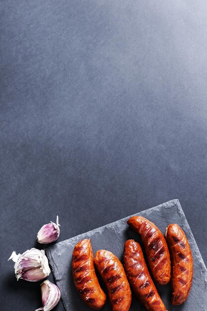 Photo grilled sausage on the table