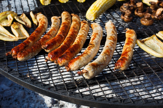 Grilled sausages at bbq outdoors