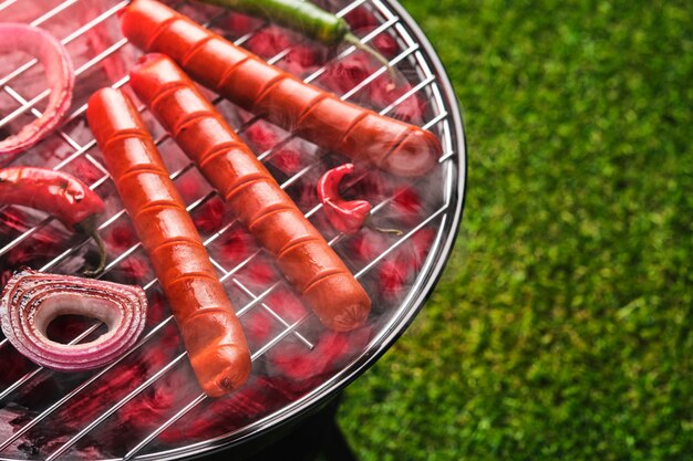 Grilled sausages on grill. Top view.