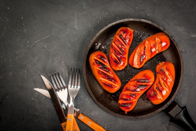 Grilled sausages on pan