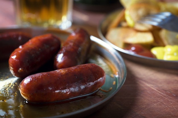 Grilled sausages prepared on grill