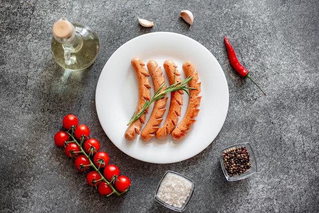 grilled sausages on stone background