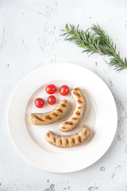 Grilled sausages with cherry tomatoes