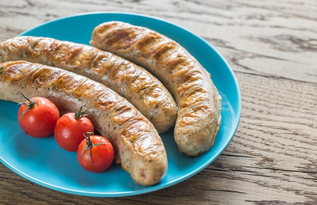 Grilled sausages with cherry tomatoes