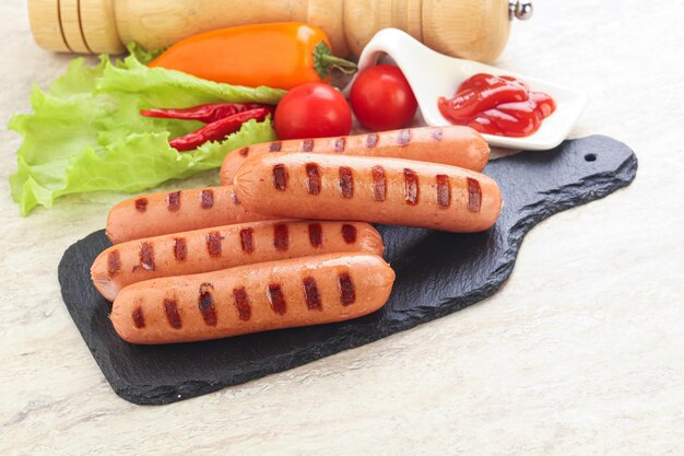 Grilled sausages with tomato sauce