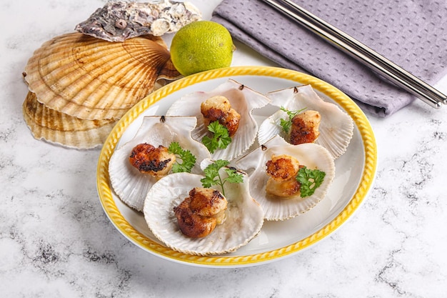 Grilled scallops shell with butter