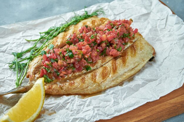 Grilled sea bass fish with tomato salsa