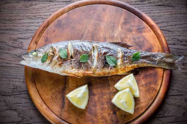 Grilled seabass on the wooden board