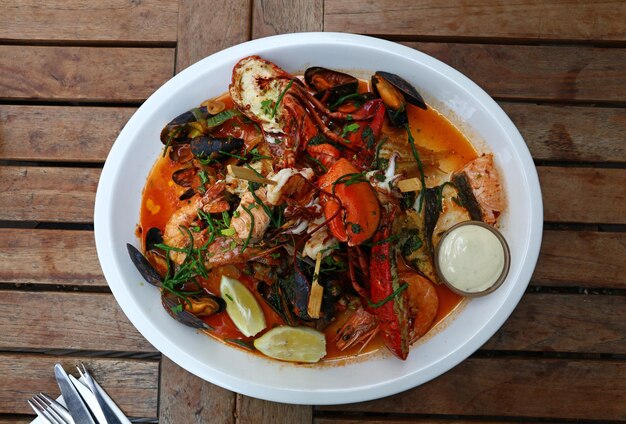 Grilled seafood platter on wooden table