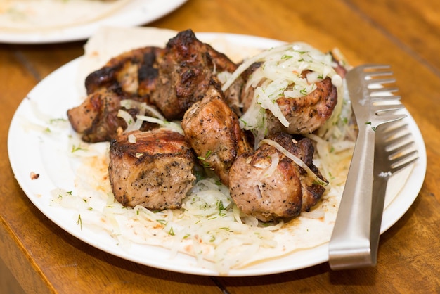 Grilled shish kebab pieces on a plate