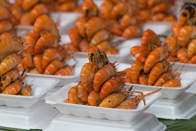 Grilled shrimp in foam box at Thai market