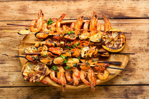 Grilled shrimp and mussels on wooden stick